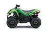 Side angle of a green ATV staged in a white studio background.