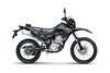 Profile angle of a dark grey motorcycle staged in a white studio background.
