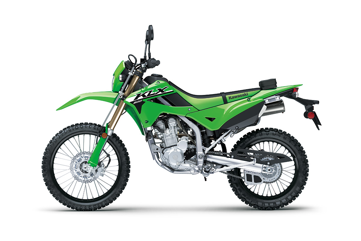 Profile angle of a green motorcycle staged in a white studio background.