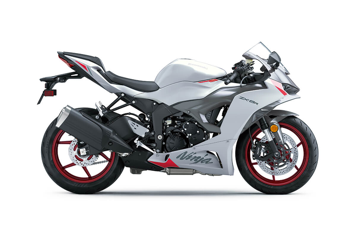 Side angle of a white motorcycle staged in a white studio background.