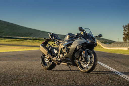 Three-quarter front angle of a motorcycle parked on track. opens in a new window