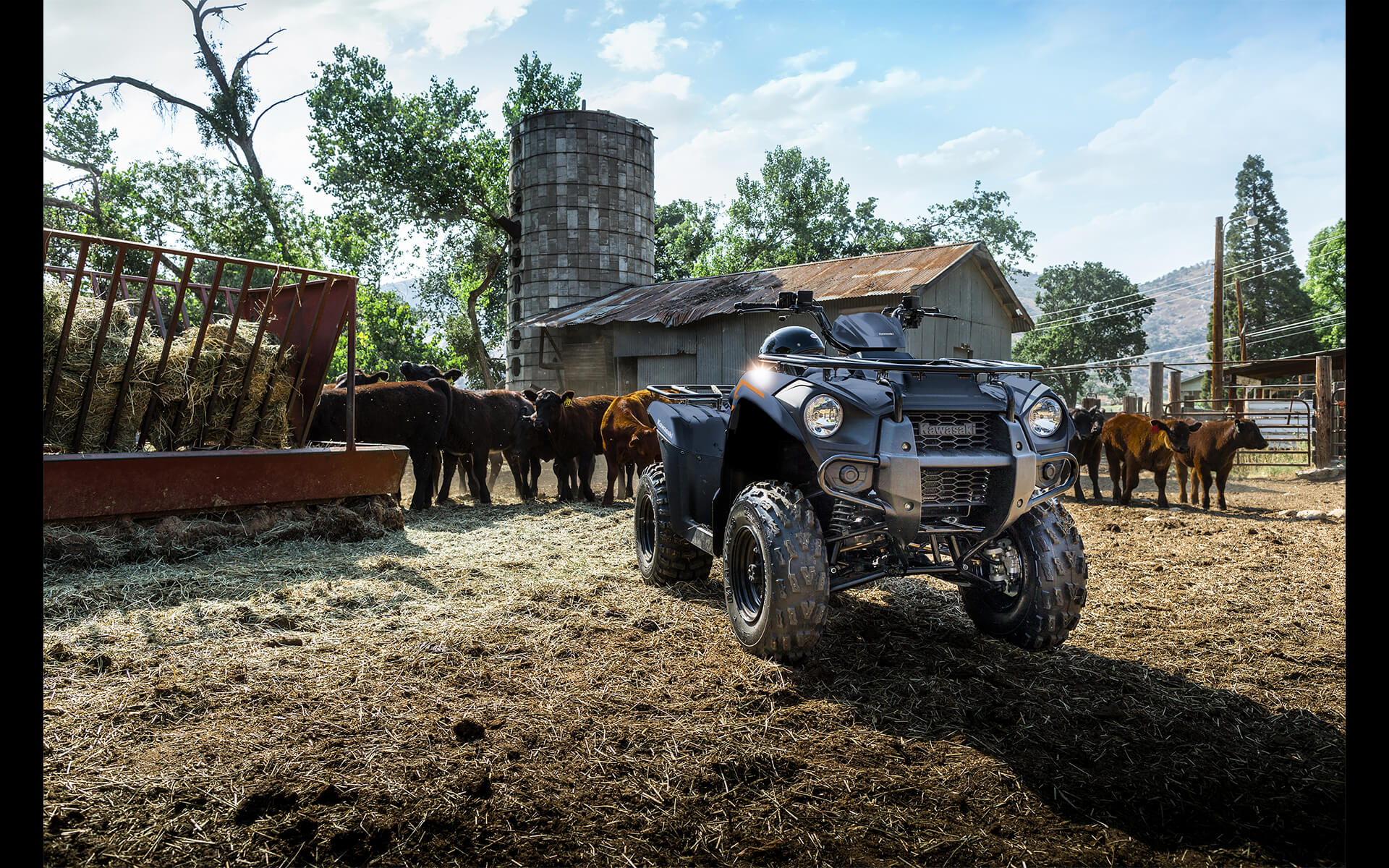 Three-quarter front angle of an ATV parked on a farm.