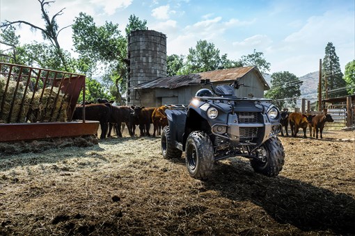 Three-quarter front angle of an ATV parked on a farm. opens in a new window