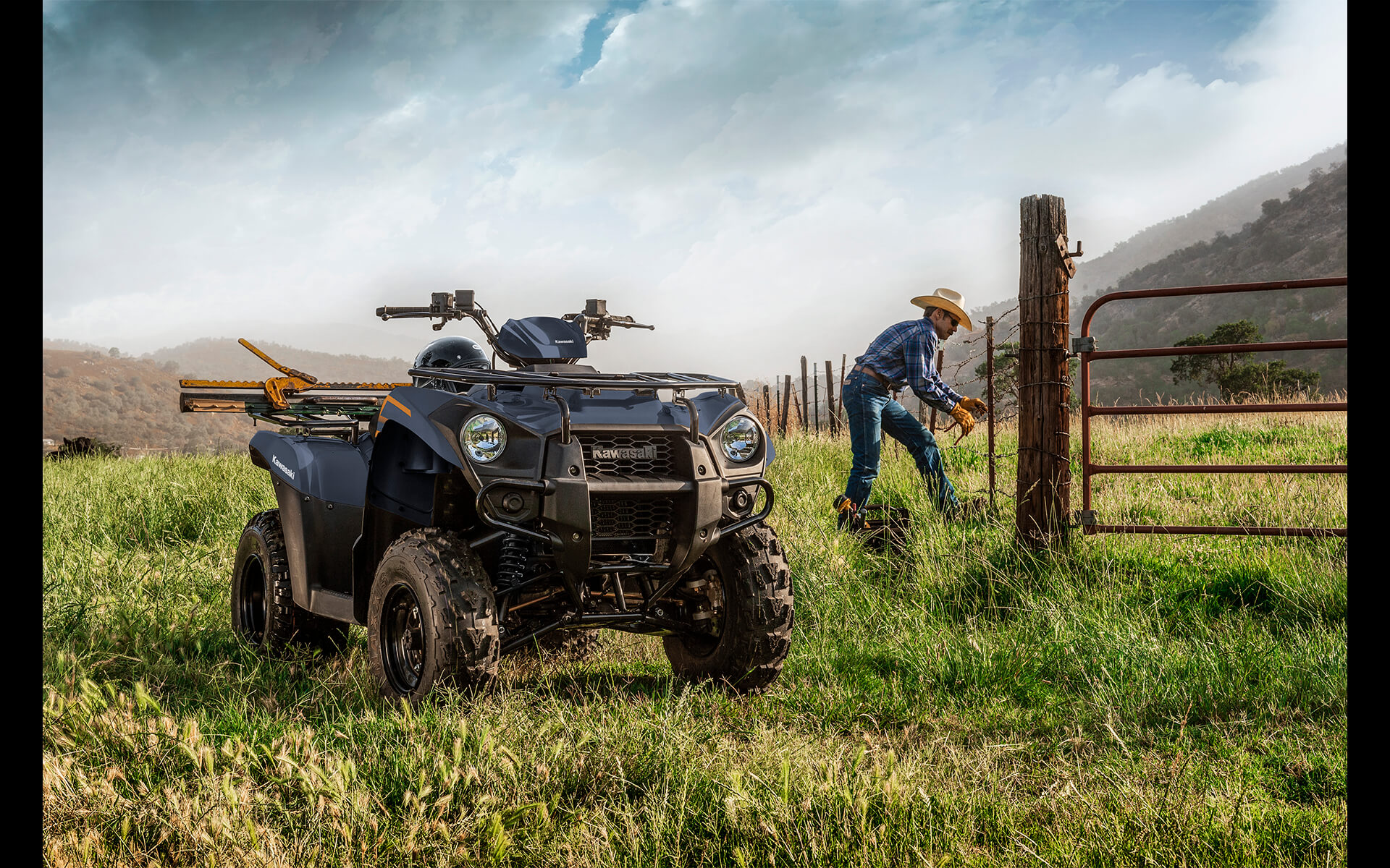 Front three-quarter angle of an ATV parked on a farm.