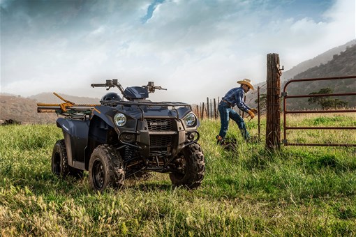 Front three-quarter angle of an ATV parked on a farm. opens in a new window