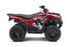 Profile angle of a red ATV staged in a white studio background.