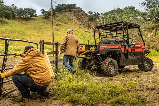 Three-quarter rear angle of a side x side parked off-road. opens in a new window