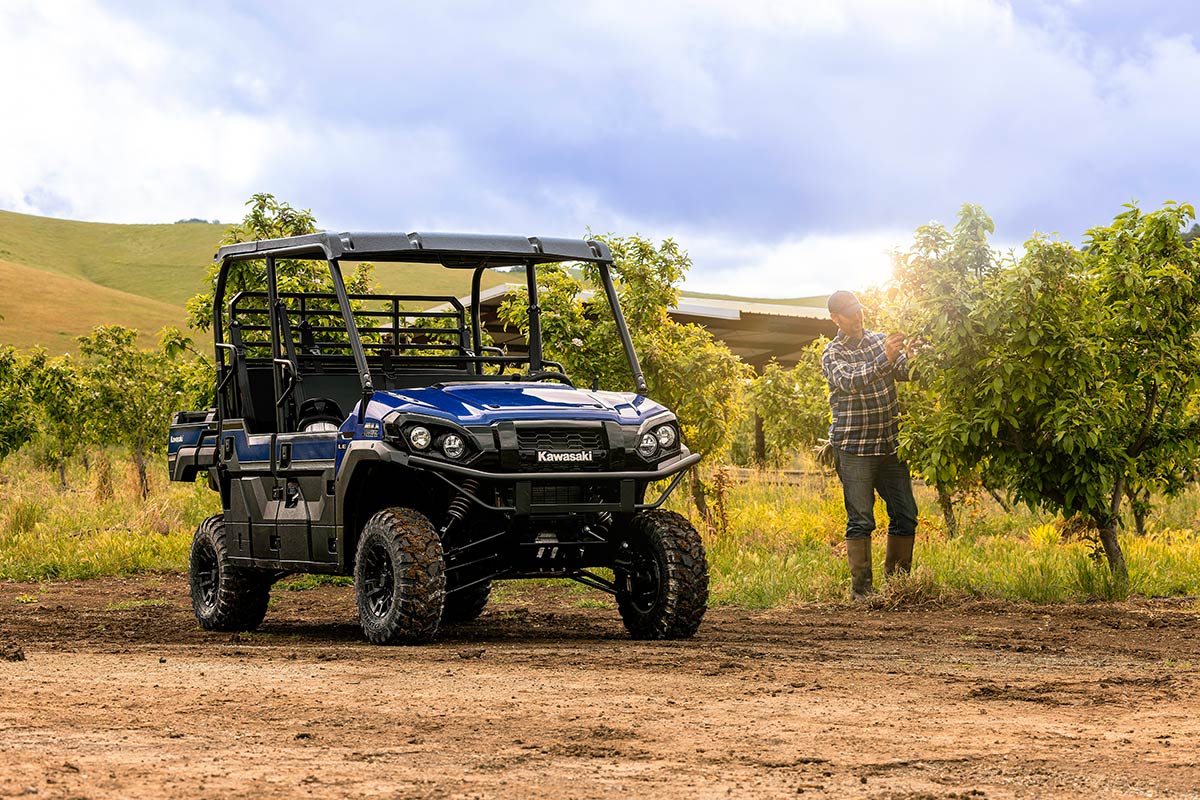 Three-quarter front angle of a parked side x side in a field.