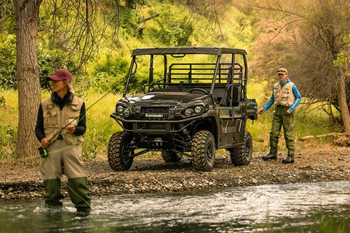 Three-quarter front angle of a side x side parked near a river. opens in a new window