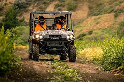 Front angle of a person driving a side x side off-road. opens in a new window