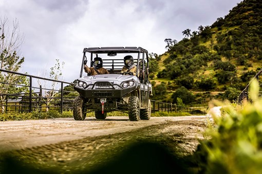 Front angle of a person driving a side x side off-road. opens in a new window
