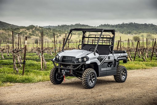 Three-quarter front angle of a side x side parked off-road. opens in a new window