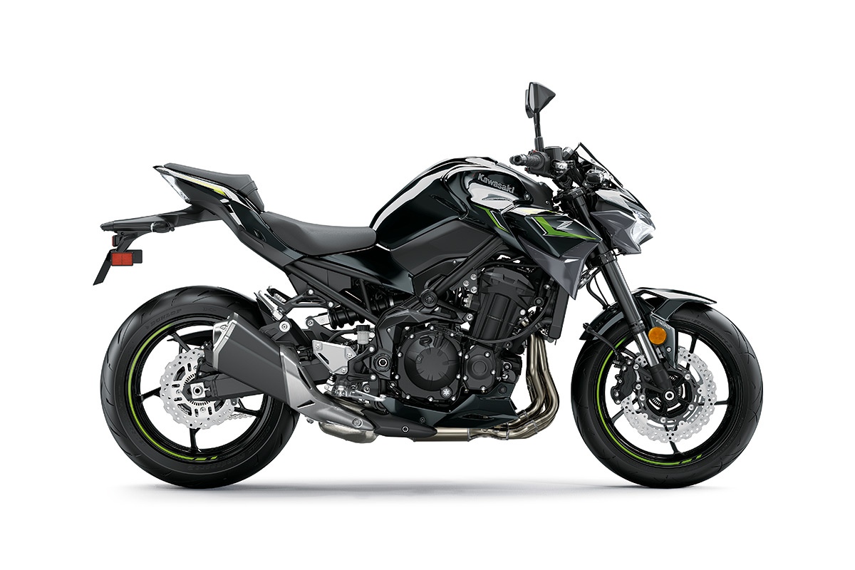 Side angle of a black motorcycle staged in a white studio background.