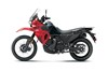 Profile angle of a red motorcycle staged in a white studio background.
