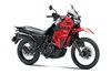 Three-quarter front angle of a red motorcycle staged in a white studio background.