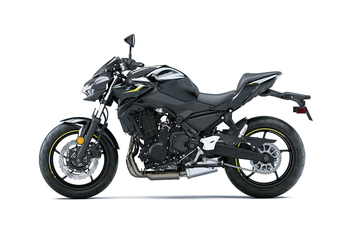 Side angle of a black motorcycle staged in a white studio background.