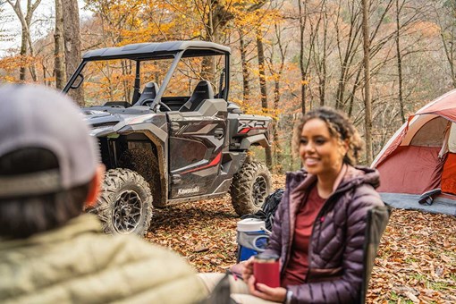 Side angle of a side x side parked near a campsite. opens in a new window