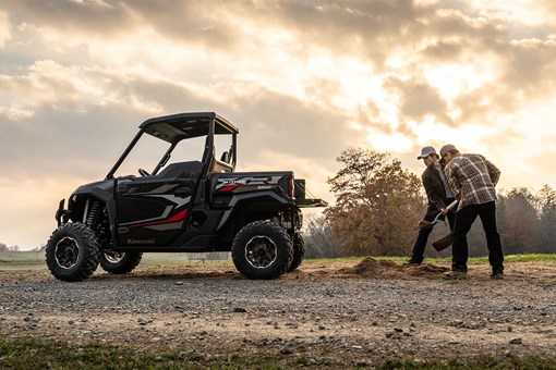 Side angle of a side x side parked near a trail. opens in a new window