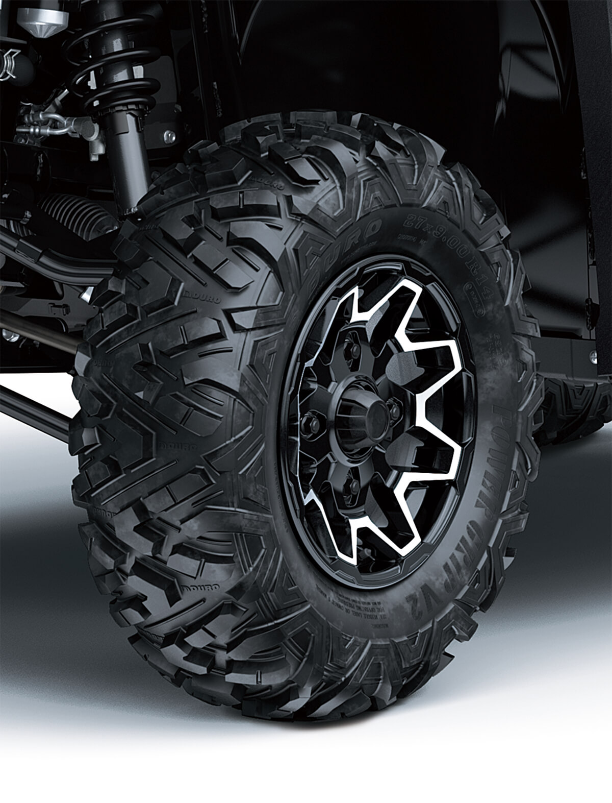 Closeup, three-quarter front angle of a side x side's wheel.