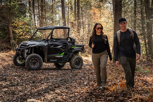 Side angle of a parked side x side in the woods. opens in a new window