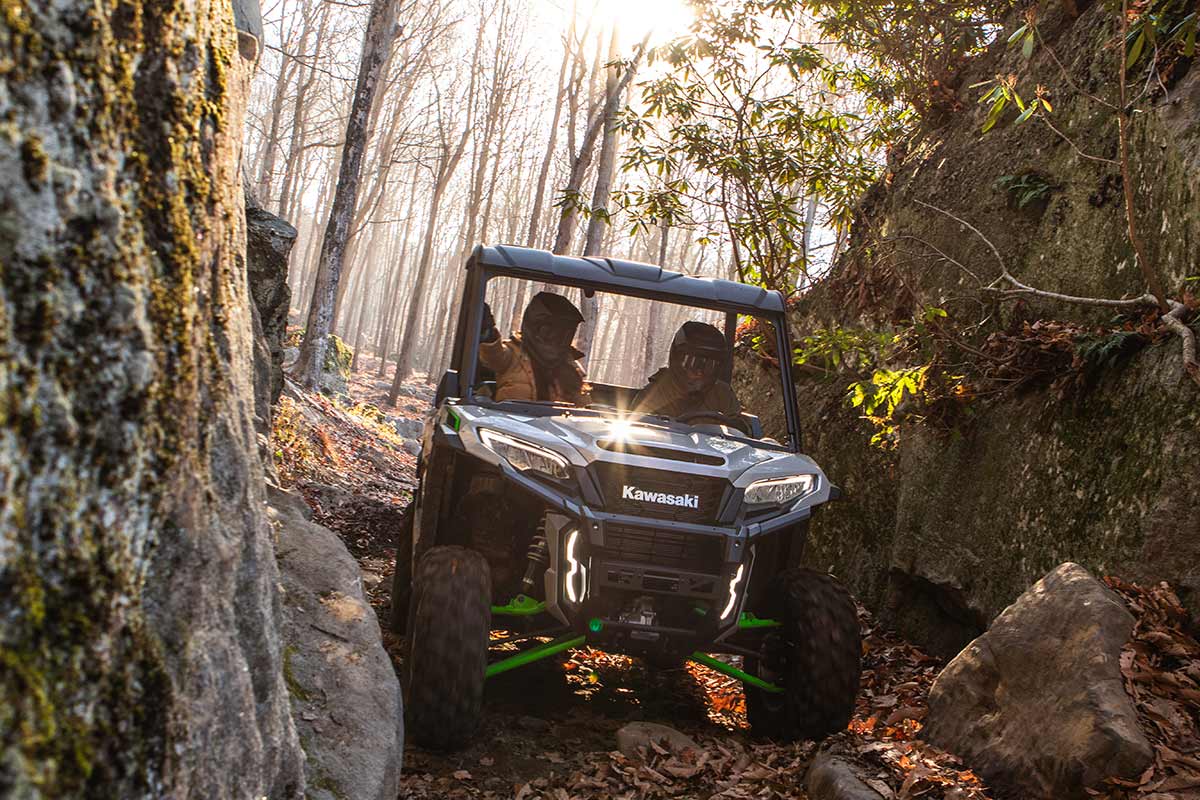 Front angle of a person driving a side x side off-road.