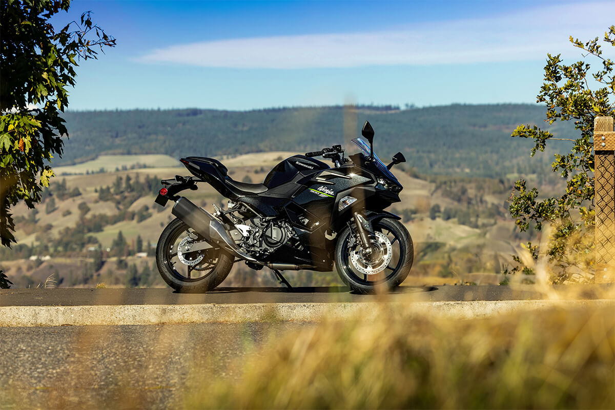 Side angle of a motorcycle parked on a road.