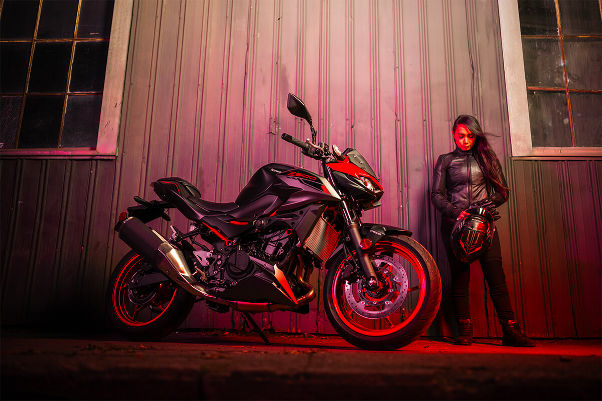 Side angle of a motorcycle parked near a building.