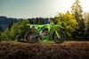 Profile angle of a motorcycle staged on dirt.