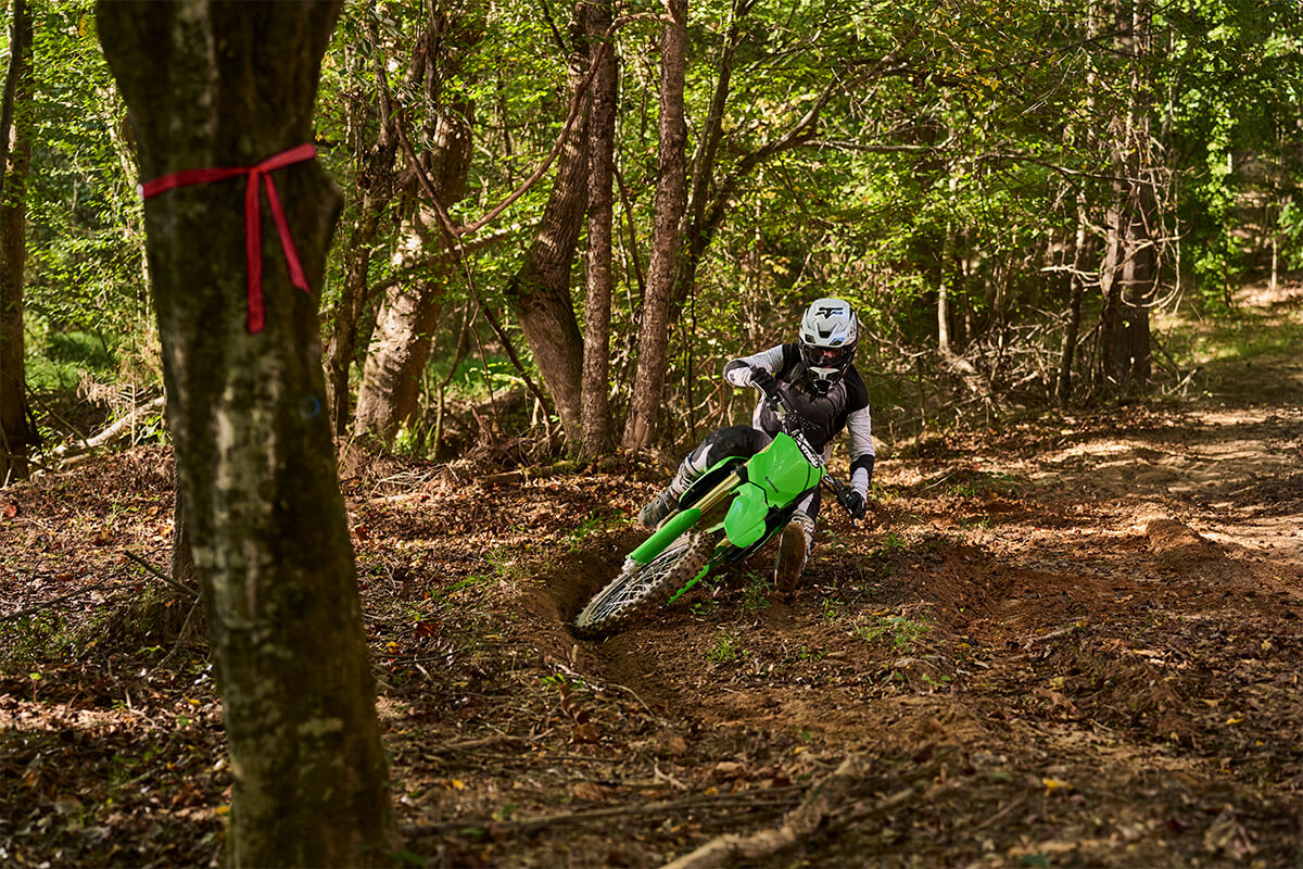 Front angle of a person riding a motorcycle off-road.
