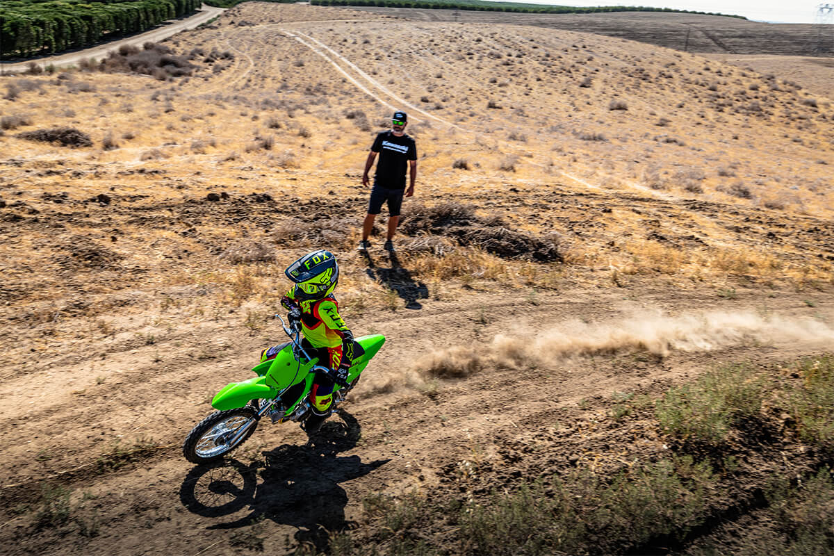 Aerial angle of a person riding a motorcycle off-road.