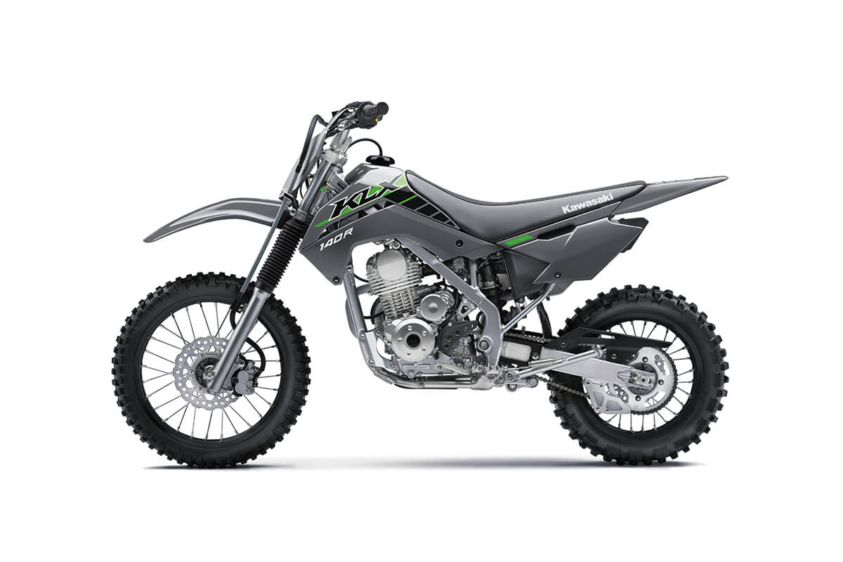 Side angle of a gray motorcycle staged in a white studio background.