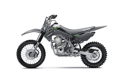 Side angle of a gray motorcycle staged in a white studio background. opens in a new window