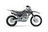 Profile angle of a gray motorcycle staged in a white studio background.