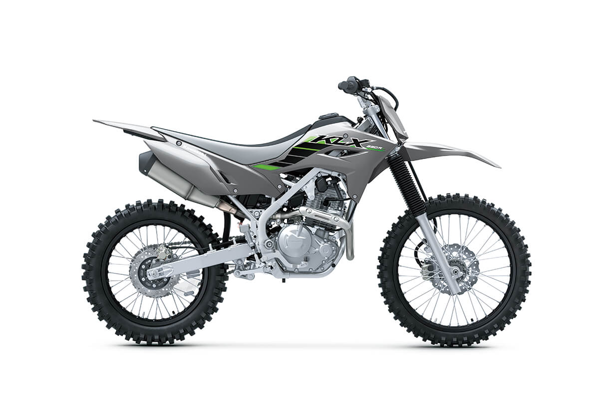 Profile angle of a grey motorcycle staged in a white studio background.
