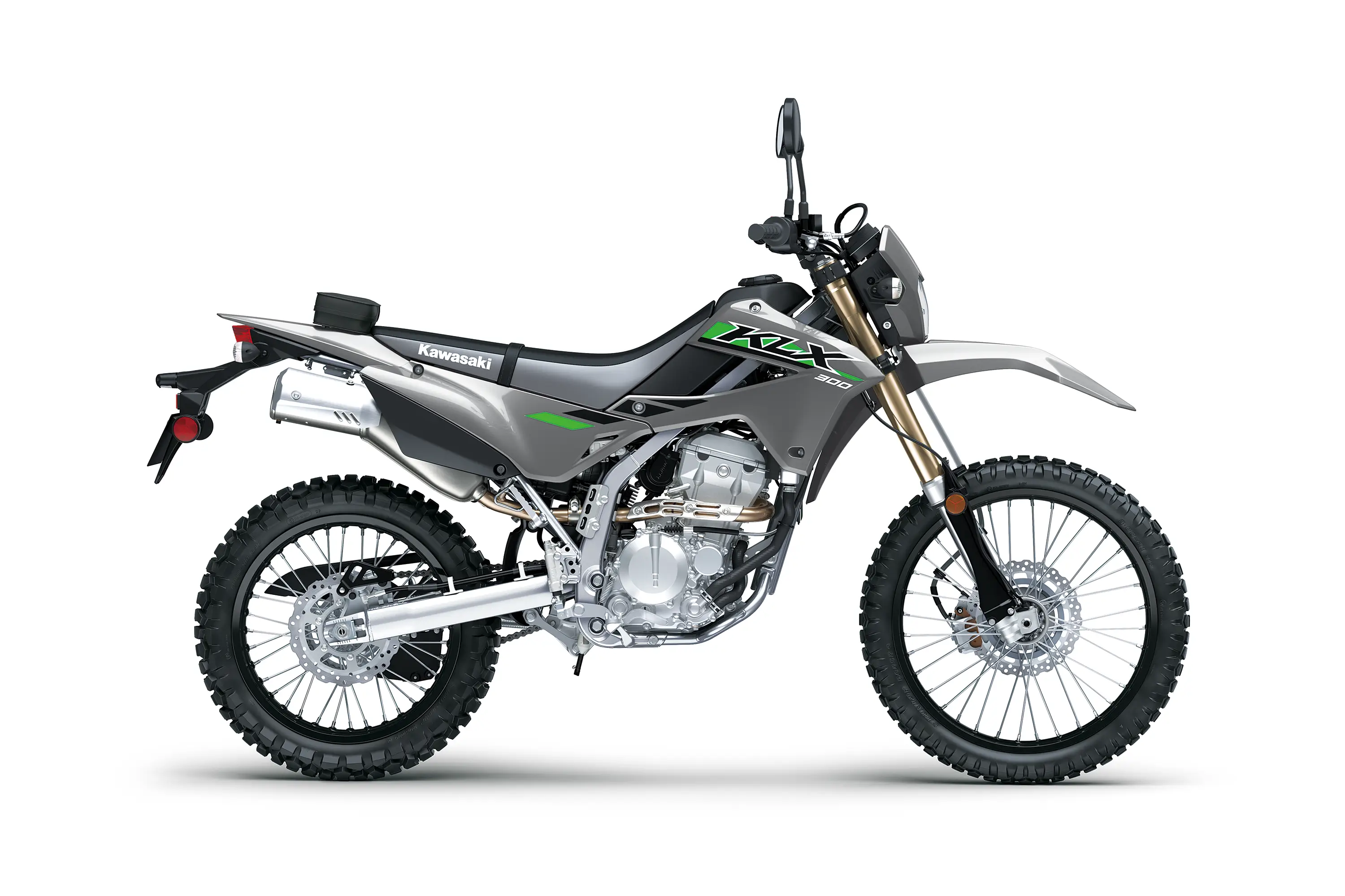 Profile angle of a gray motorcycle staged in a white studio background.