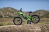 Side angle of an electric balance bike staged outside.