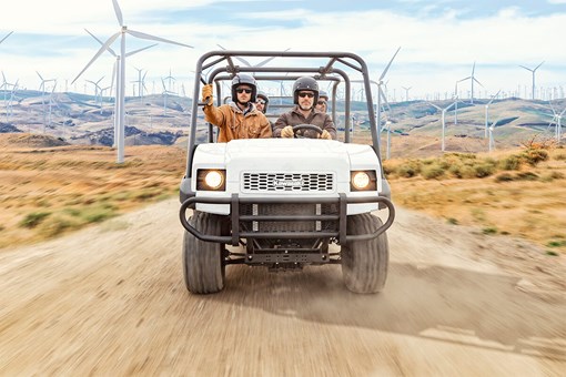 Front angle of a person driving a side x side off-road. opens in a new window