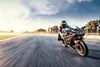 Front angle of a person riding a motorcycle on a track.