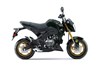 Profile angle of a motorcycle staged in a white studio background.