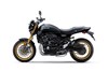 Profile angle of a motorcycle staged in a white studio background.