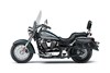 Profile angle of a motorcycle staged in a white studio background.