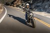 Front angle of a person riding a motorcycle on a highway.