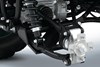 Close-up view of the suspension components of an ATV.