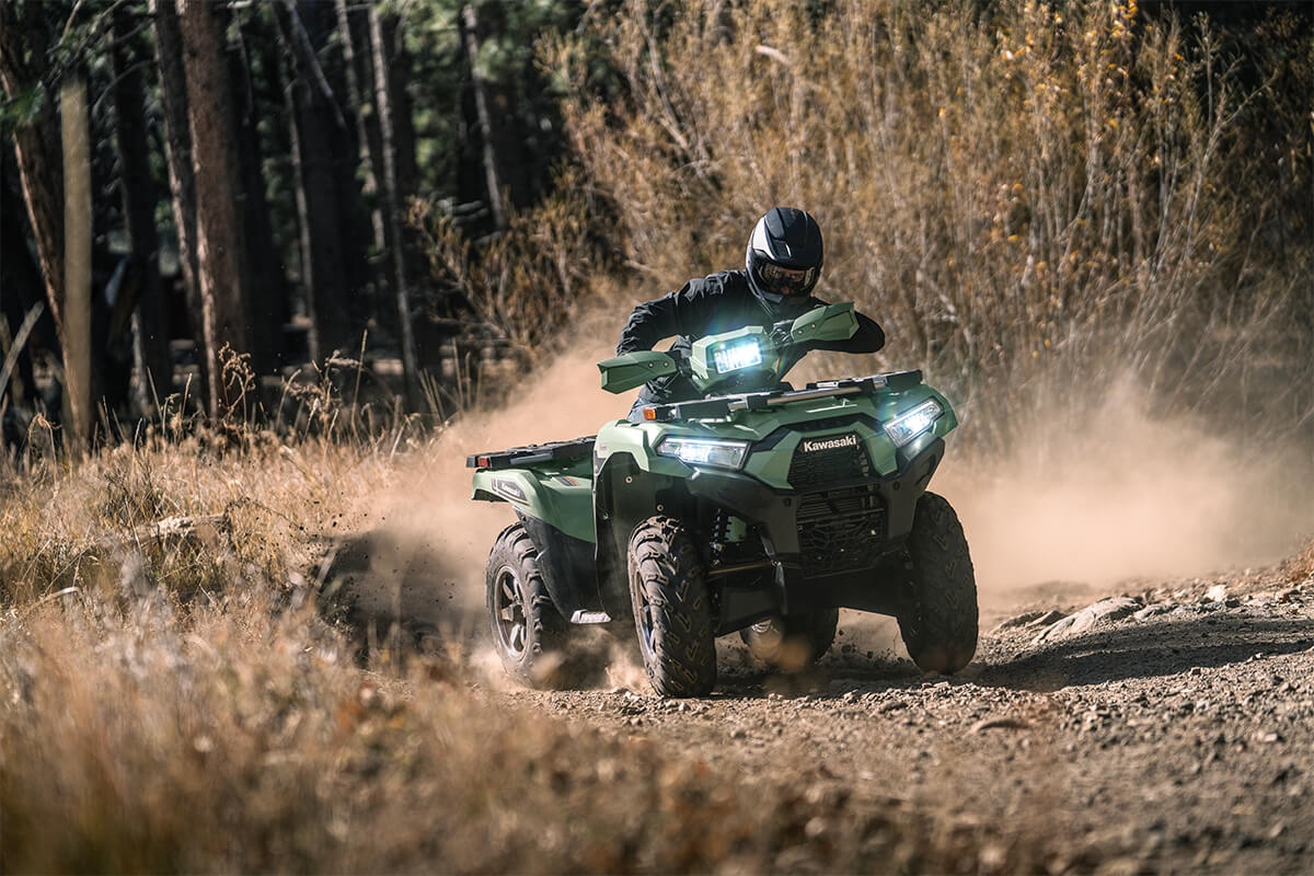 Front view of a person riding an ATV off-road.