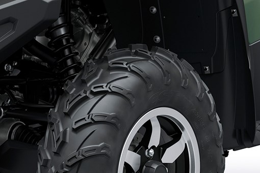 Detail view of the tire tread and alloy wheel of an ATV. opens in a new window