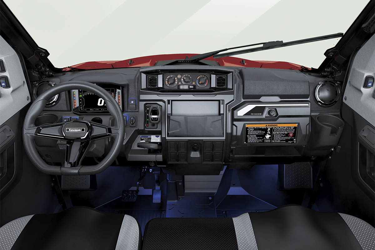 Front angle of the dashboard of a side x side staged in a white studio background.