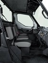 Profile view of interior of a side x side showing passenger seating in a white studio background.