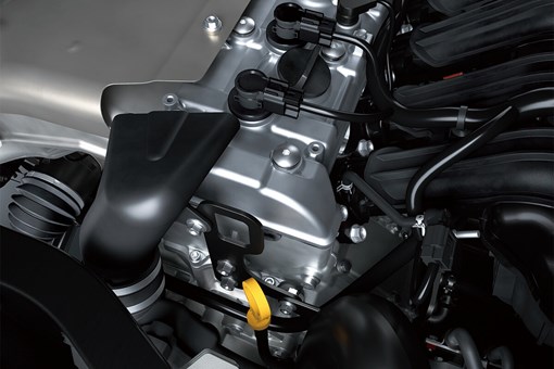 Close-up view of the four-cylinder engine in a side x side. opens in a new window