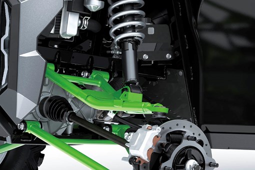 Close-up view of the shock and A-arm of a side x side staged in a white studio background. opens in a new window