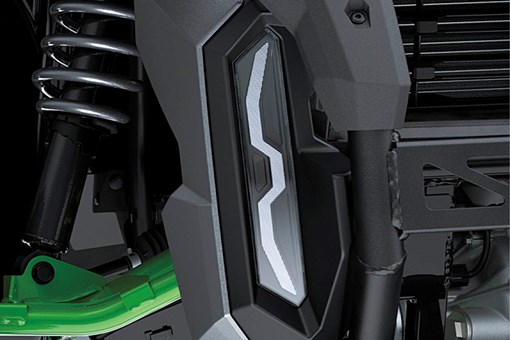 Close-up view of the headlight of a side x side. opens in a new window